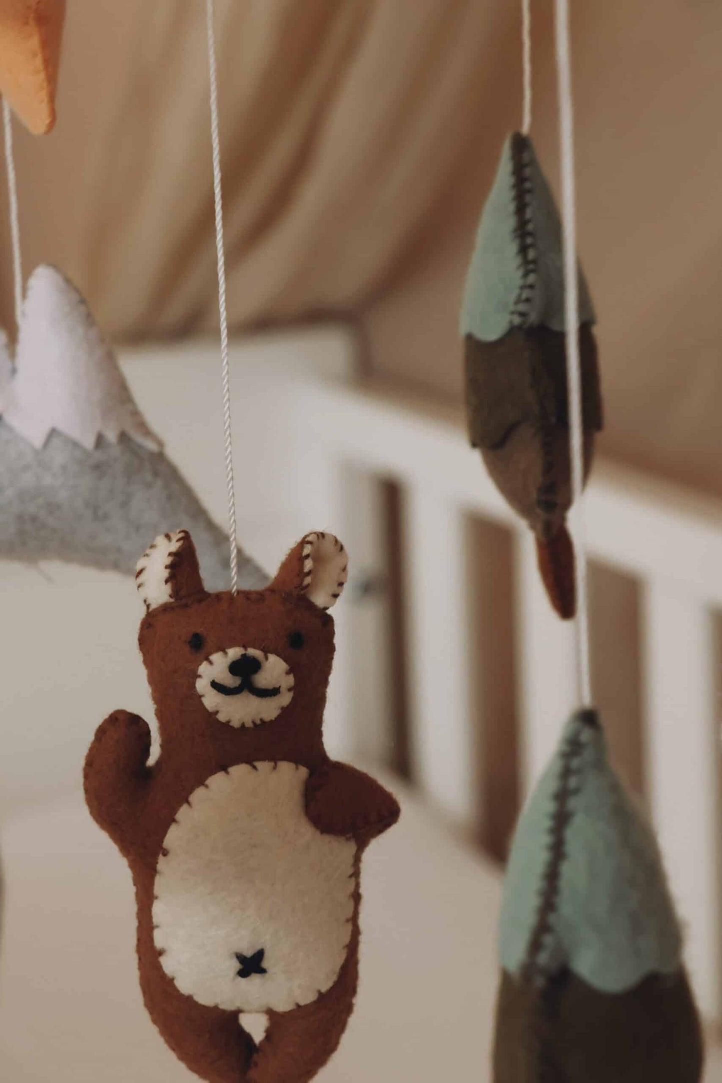 handmade brown bear mobile crib close up